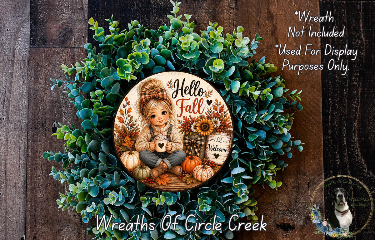 A wreath made of green leaves and autumn-themed decorations, including a girl holding a coffee mug and a sign that says "Welcome".