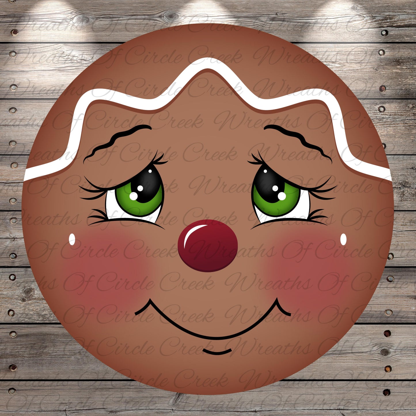 A close-up of a gingerbread man's face with a red nose, green eyes, and a big smile, set against a wooden background.