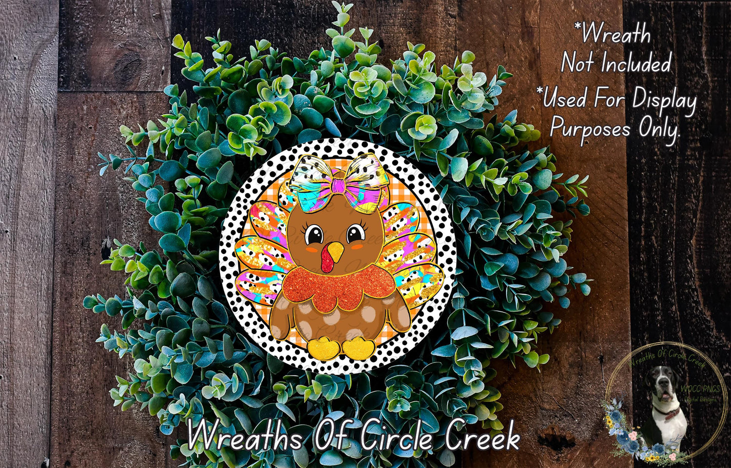 A wreath made of green plants and featuring a colorful illustration of a brown bird with a bow on its head.