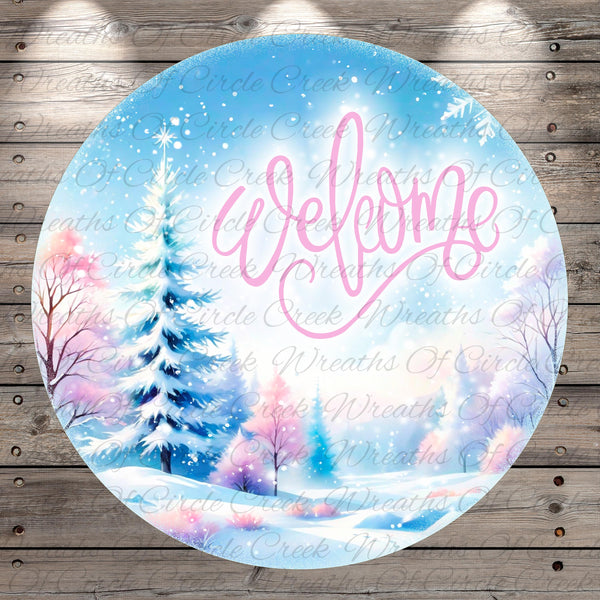 A circular winter scene with a snowy landscape, pine trees, and a "Welcome" message in pink cursive text.