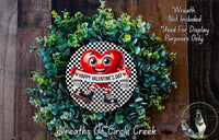 a wreath with a heart-shaped ornament and a banner that says "Happy Valentine's Day". The wreath is made of green leaves and has a wooden background.