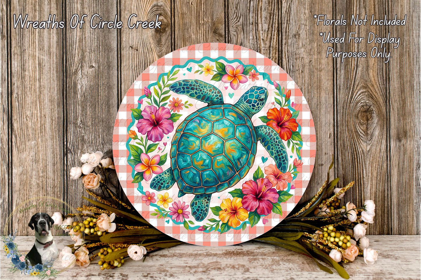 a round, decorative plate with a vibrant illustration of a turtle surrounded by a colorful floral arrangement. The plate is placed on a wooden surface, and there are also some flowers and greenery nearby.