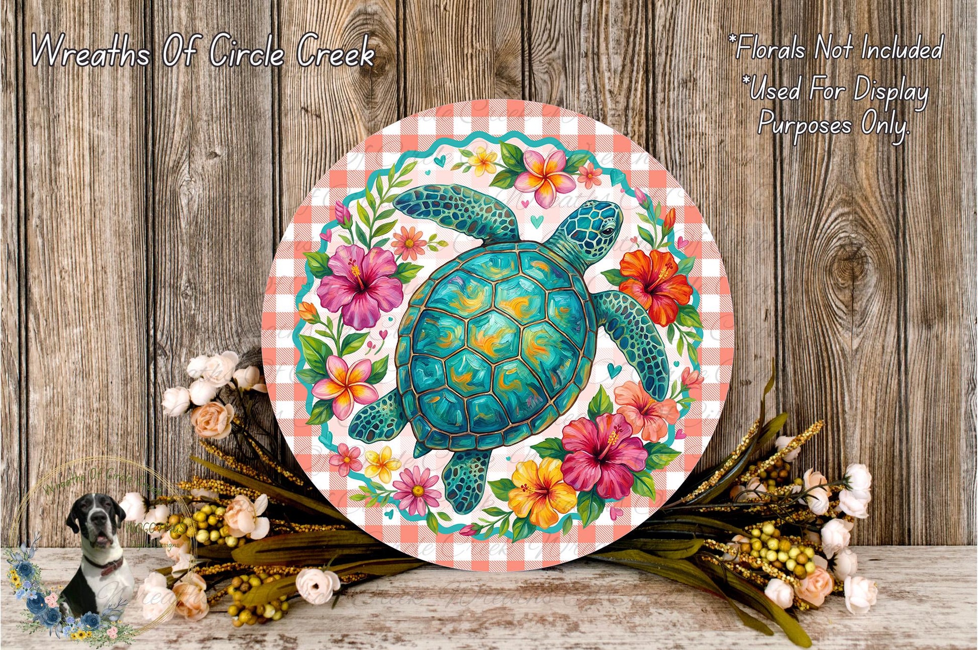 a round, decorative plate with a vibrant illustration of a turtle surrounded by a colorful floral arrangement. The plate is placed on a wooden surface, and there are also some flowers and greenery nearby.