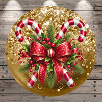A festive Christmas-themed image featuring two candy canes, a red bow, holly leaves, berries, and a gold glitter background.
