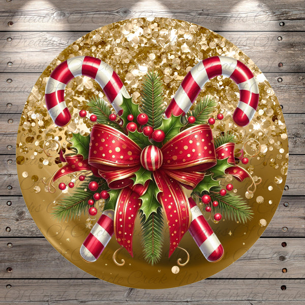 A festive Christmas-themed image featuring two candy canes, a red bow, holly leaves, berries, and a gold glitter background.
