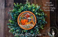 a wreath made of green foliage and a pumpkin, with a football and sunflowers on it. The wreath is displayed on a wooden surface, and there is a text overlay that reads "Wreath Not Included * Used For Display Purposes Only".