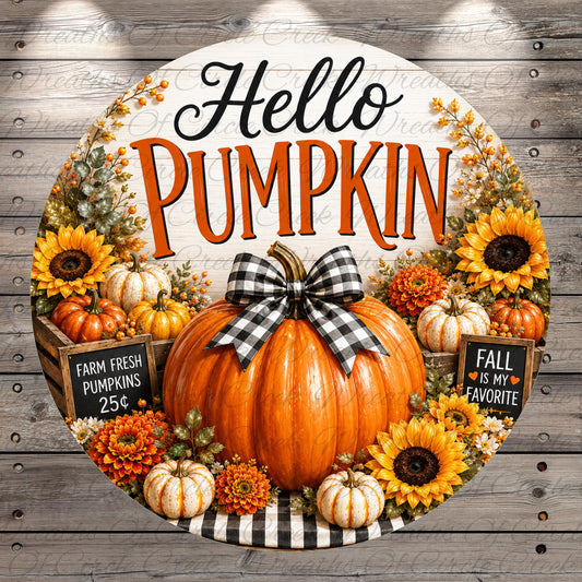 A round wooden sign with the text "Hello Pumpkin" surrounded by autumn decorations such as pumpkins, sunflowers, and a bow.