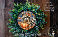 A wreath featuring a raccoon holding a pumpkin, surrounded by green foliage, with a text overlay that reads "Wreath Not Included * Used For Display Purposes Only" and "Wreaths of Circle Creek".