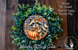 A wreath featuring a raccoon holding a pumpkin, surrounded by green foliage, with a text overlay that reads "Wreath Not Included * Used For Display Purposes Only" and "Wreaths of Circle Creek".