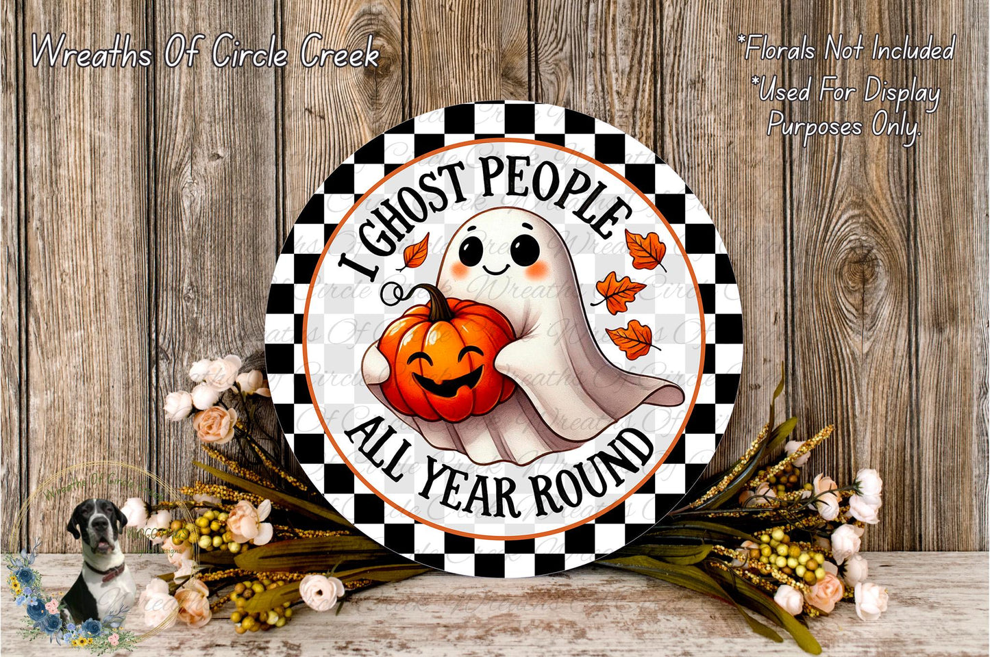 a Halloween-themed sign with a ghost holding a pumpkin, surrounded by flowers and a wooden background.
