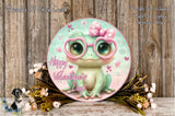 A round, decorative plate featuring a cute frog wearing pink glasses and surrounded by flowers, with the text "Happy Valentine's Day!" displayed on it.