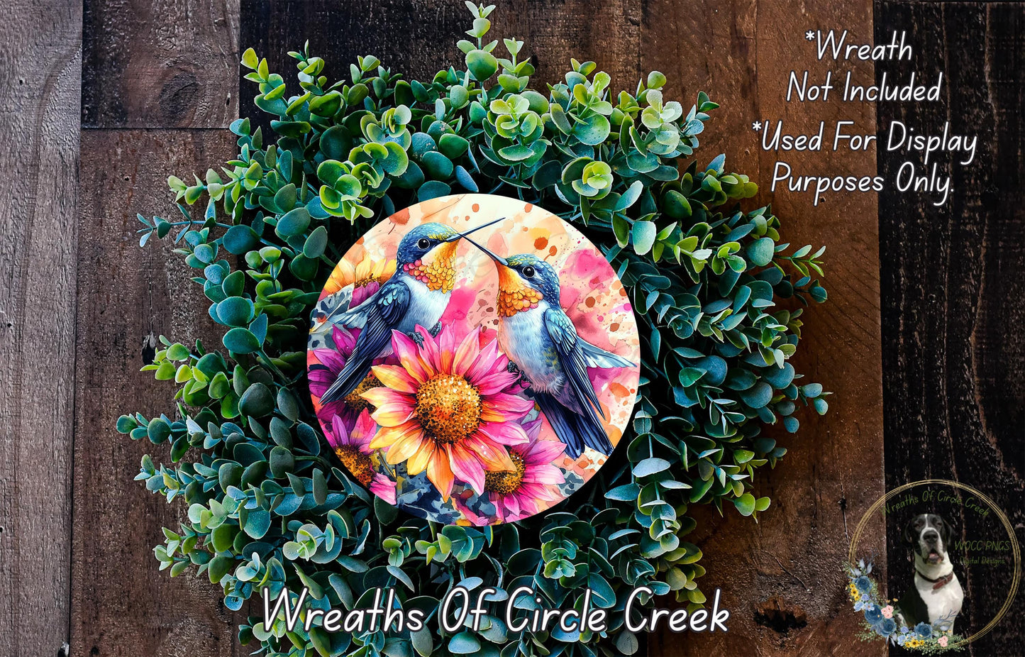 a picture of two birds on a flower wreath