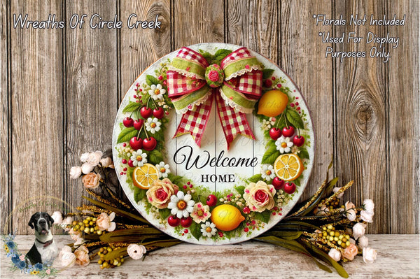 a welcome sign with a wreath of fruit and flowers