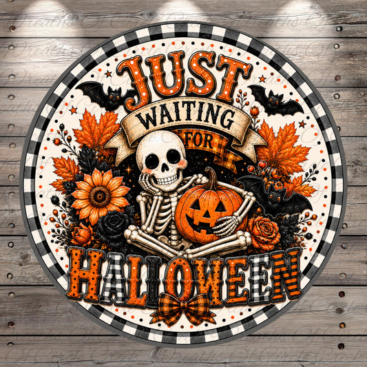 A Halloween-themed graphic with a skeleton holding a jack-o-lantern, surrounded by autumn leaves, flowers, and bats. The text "Just waiting for Halloween" is displayed above the skeleton.