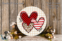 a round wooden plaque with a heart design, surrounded by flowers and foliage.