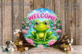 A round sign with a green frog sitting on a lily pad, surrounded by flowers and a wooden background.