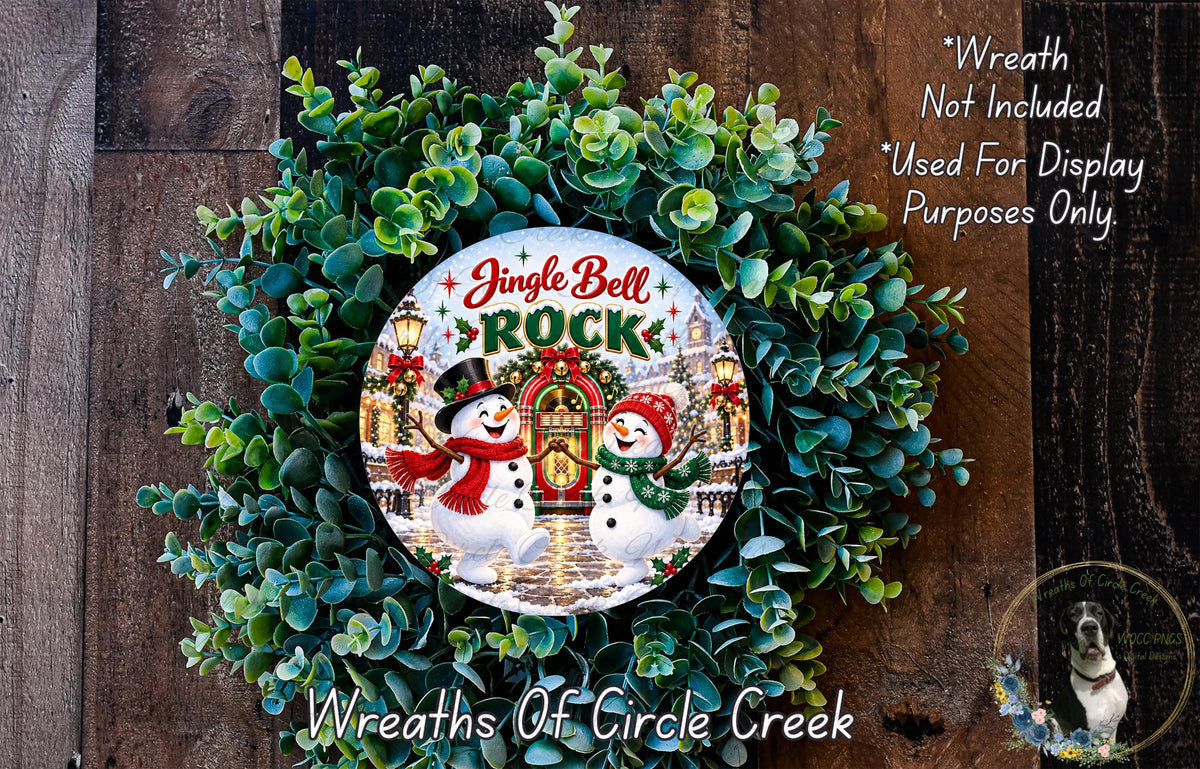 A wreath made of green foliage and featuring a snowman and a jingle bell, with the text "Jingle Bell Rock" and "Wreaths of Circle Creek" displayed.