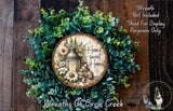 a wreath with a lantern and flowers, surrounded by greenery, and a wooden sign with the text "Home Sweet Home" on it.