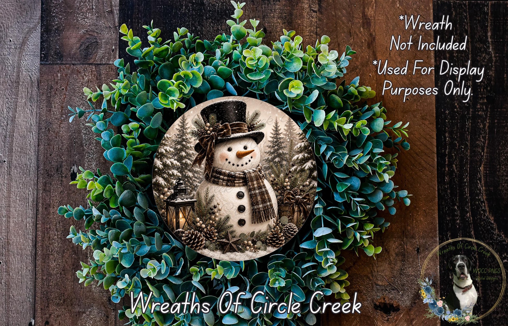 A wreath featuring a snowman surrounded by evergreen branches and pine cones, with a text overlay that reads "Wreath Not Included * Used For Display Purposes Only" and "Wreaths of Circle Creek".