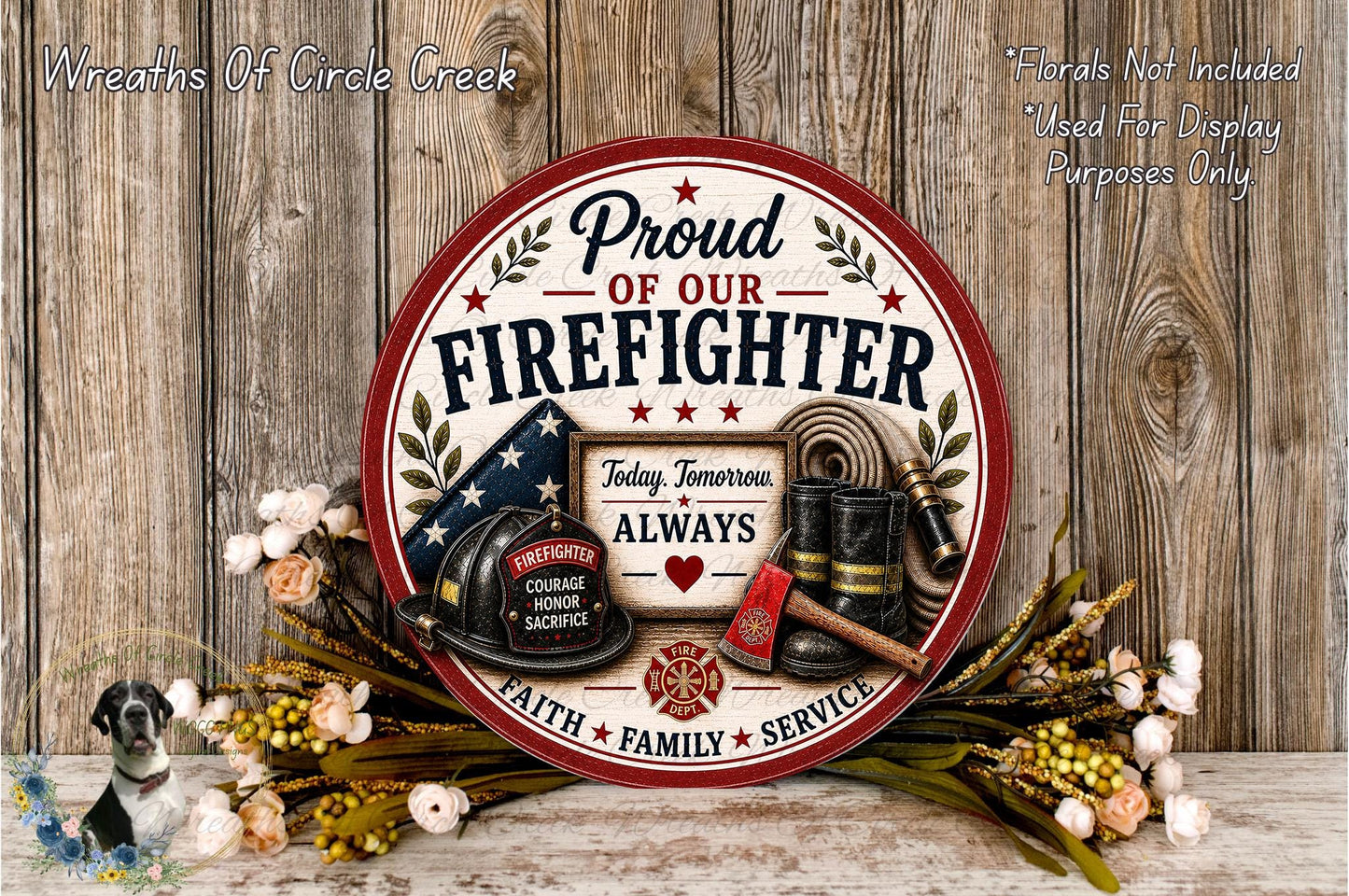 a round sign with the text "Proud of our FIREFIGHTER" and various firefighting-related items such as a fire hose, fireman's helmet, and fireman's boots. The sign is surrounded by a wreath of flowers and a wooden background.