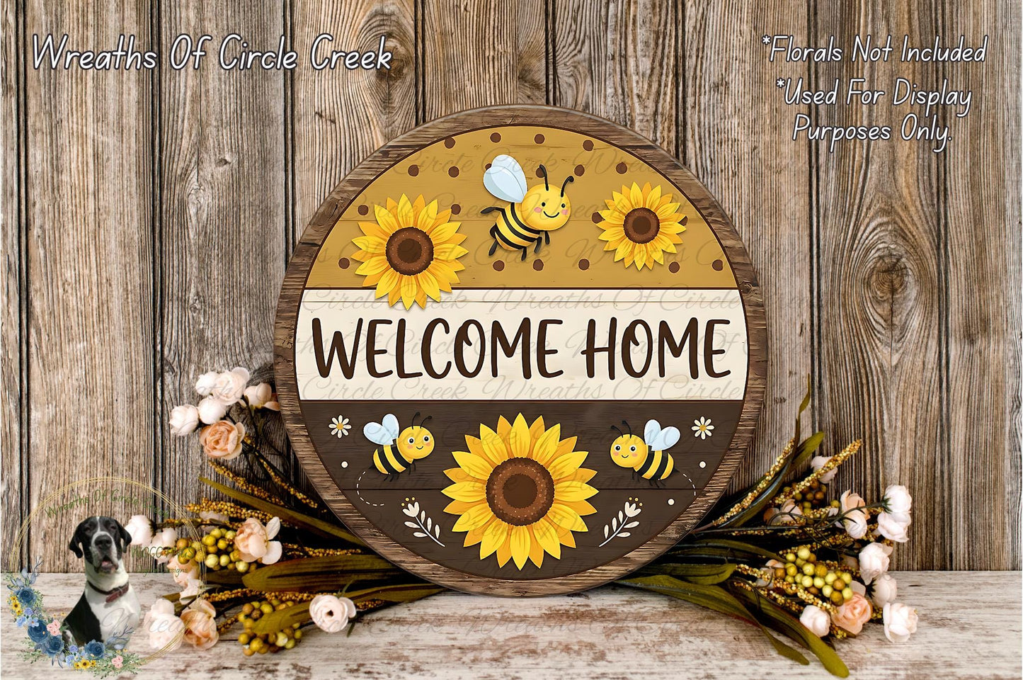 a wooden sign with a welcome home theme, surrounded by flowers and bees. The sign has a circular shape with a brown border and a white background, and it displays the text "Welcome Home" in a playful font.