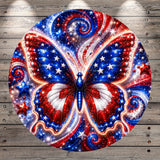 The image is a vibrant and colorful depiction of a butterfly, with its wings spread wide and adorned with stars and swirls in red, white, and blue. The butterfly is set against a backdrop of a wooden wall, creating a visually striking contrast between the natural and man-made elements.