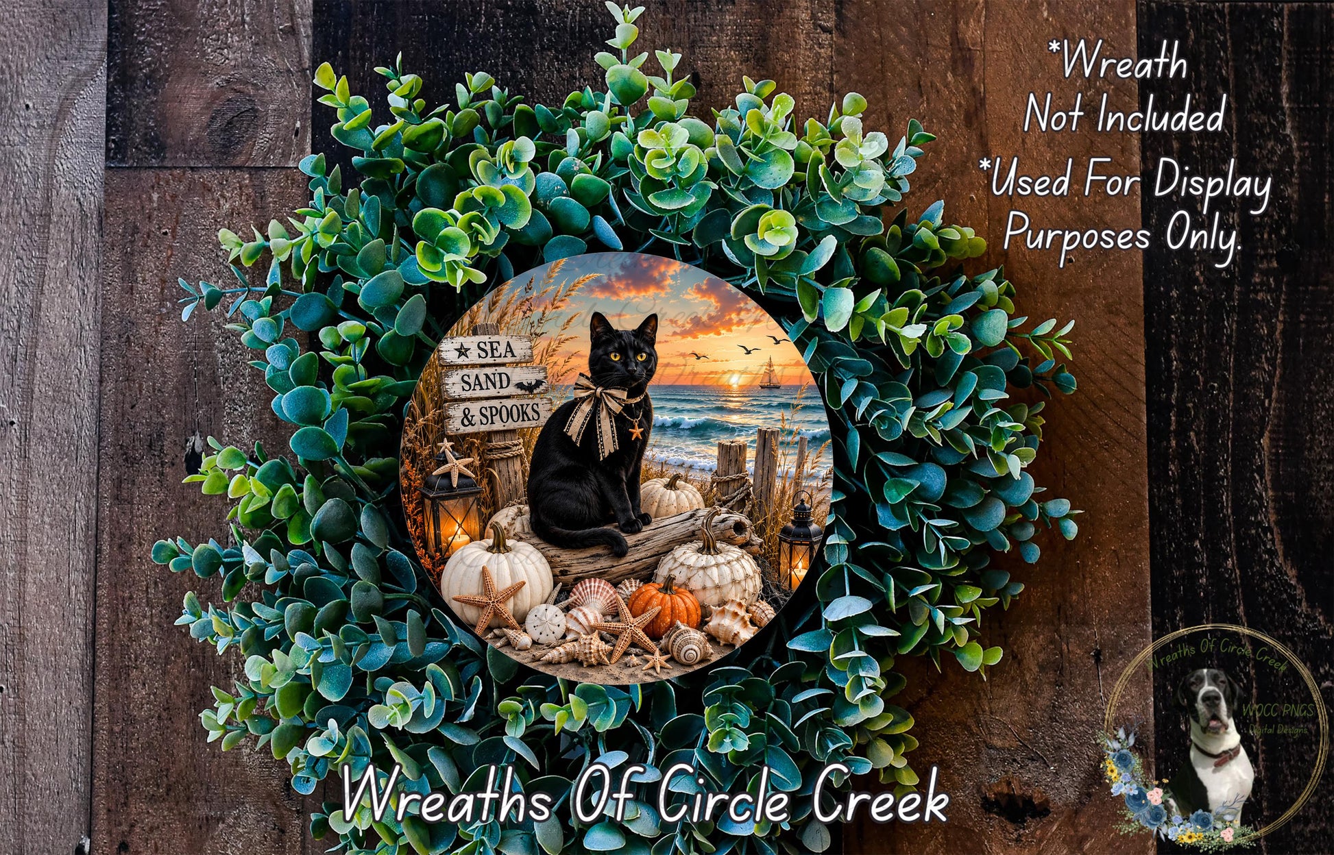 A wreath made of green foliage and white pumpkins, with a black cat sitting on a wooden log and a sunset in the background.