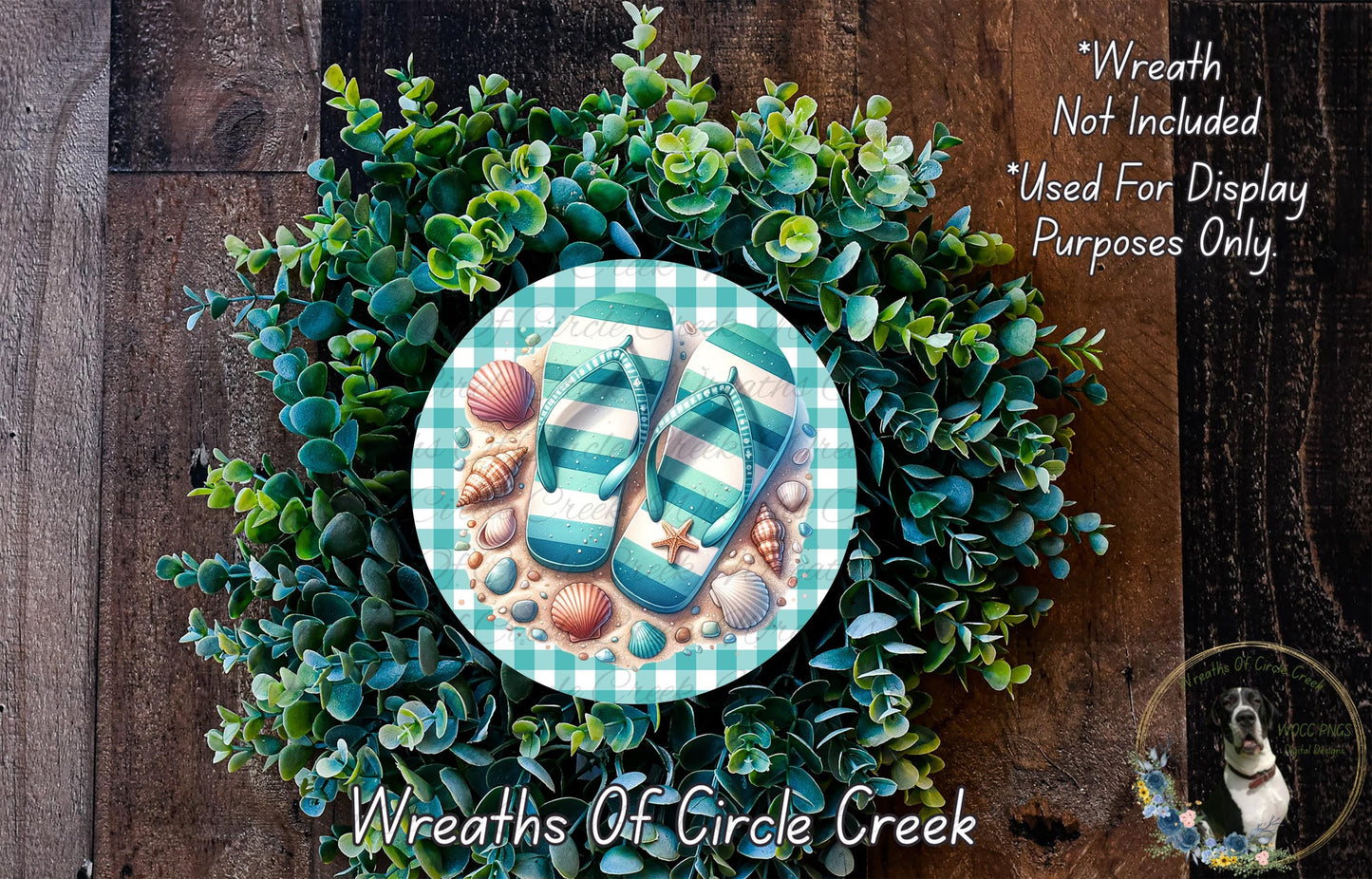A wreath made of green foliage and seashells, with a pair of flip flops placed on top of the wreath.