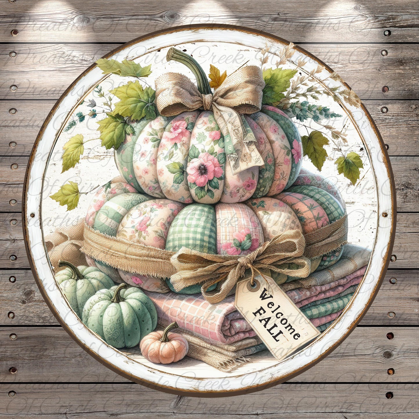 A decorative arrangement of pumpkins and blankets, with a "Welcome Fall" sign, set against a rustic wooden background.