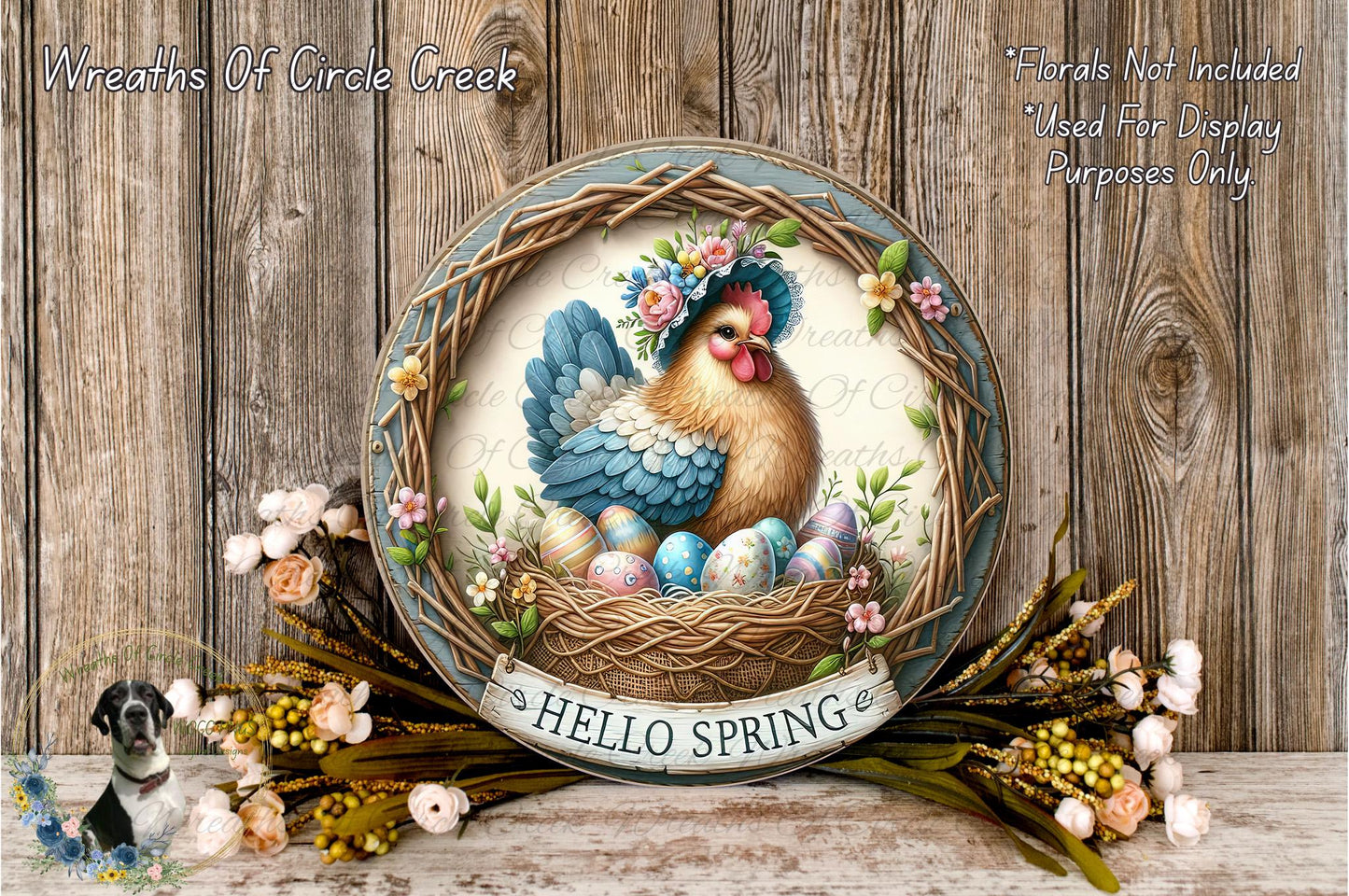 A decorative Easter wreath with a rooster and eggs, surrounded by flowers and greenery, placed on a wooden surface.