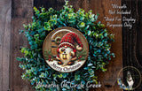 A wreath with a gnome and a lantern, surrounded by greenery, with a message that reads "Merry Christmas" and "Wreaths of Circle Creek".