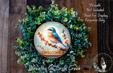 a wreath with a bird on a branch, surrounded by greenery, and a welcome sign in the center.
