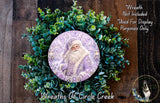A wreath featuring a Santa Claus image surrounded by greenery, with a text overlay that reads "Wreath Not Included * Used For Display Purposes Only" and "Wreaths of Circle Creek".