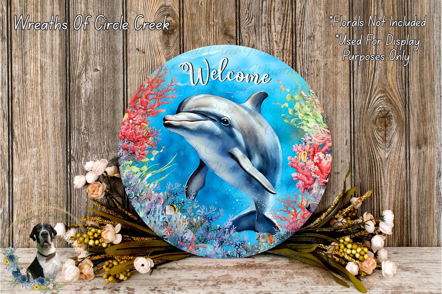 a round sign with a dolphin illustration, surrounded by a colorful underwater scene with coral and flowers. The sign has the word "Welcome" written on it.