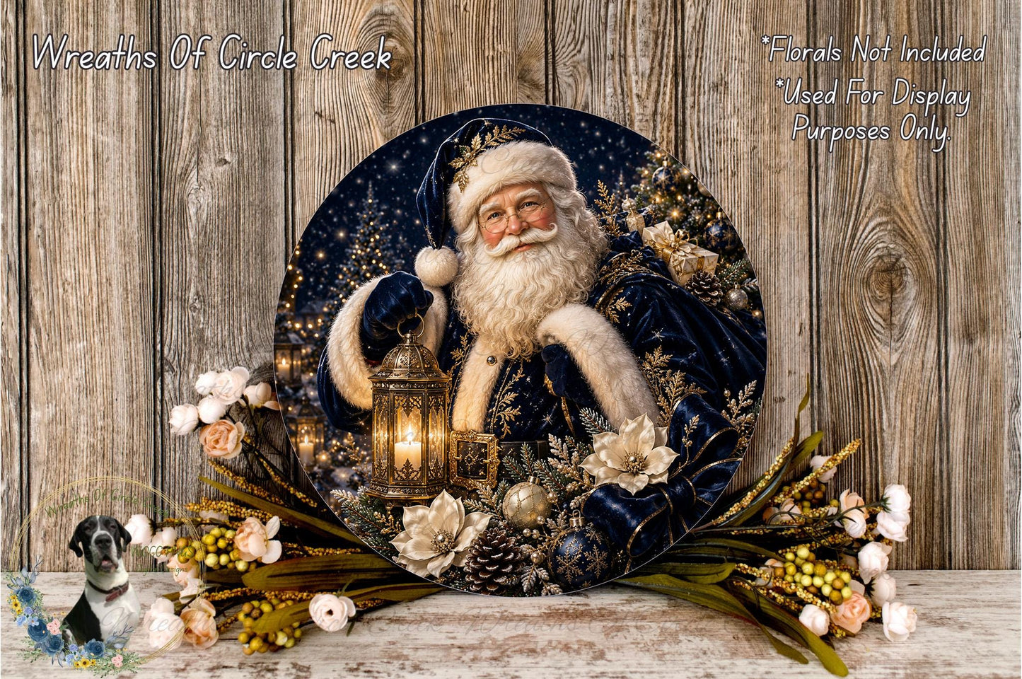 A decorative wreath featuring a smiling Santa Claus figure holding a lantern, surrounded by flowers and greenery, placed on a wooden surface.