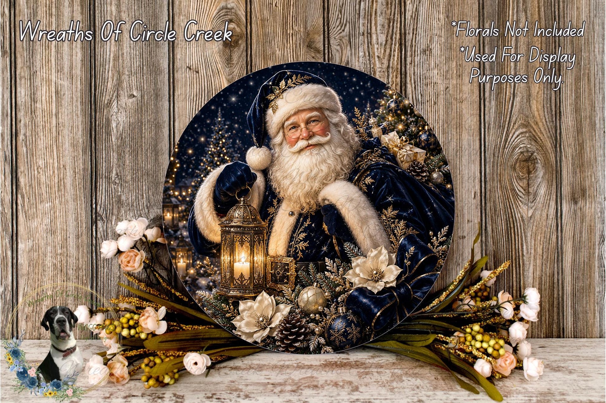 A decorative wreath featuring a smiling Santa Claus figure holding a lantern, surrounded by flowers and greenery, placed on a wooden surface.