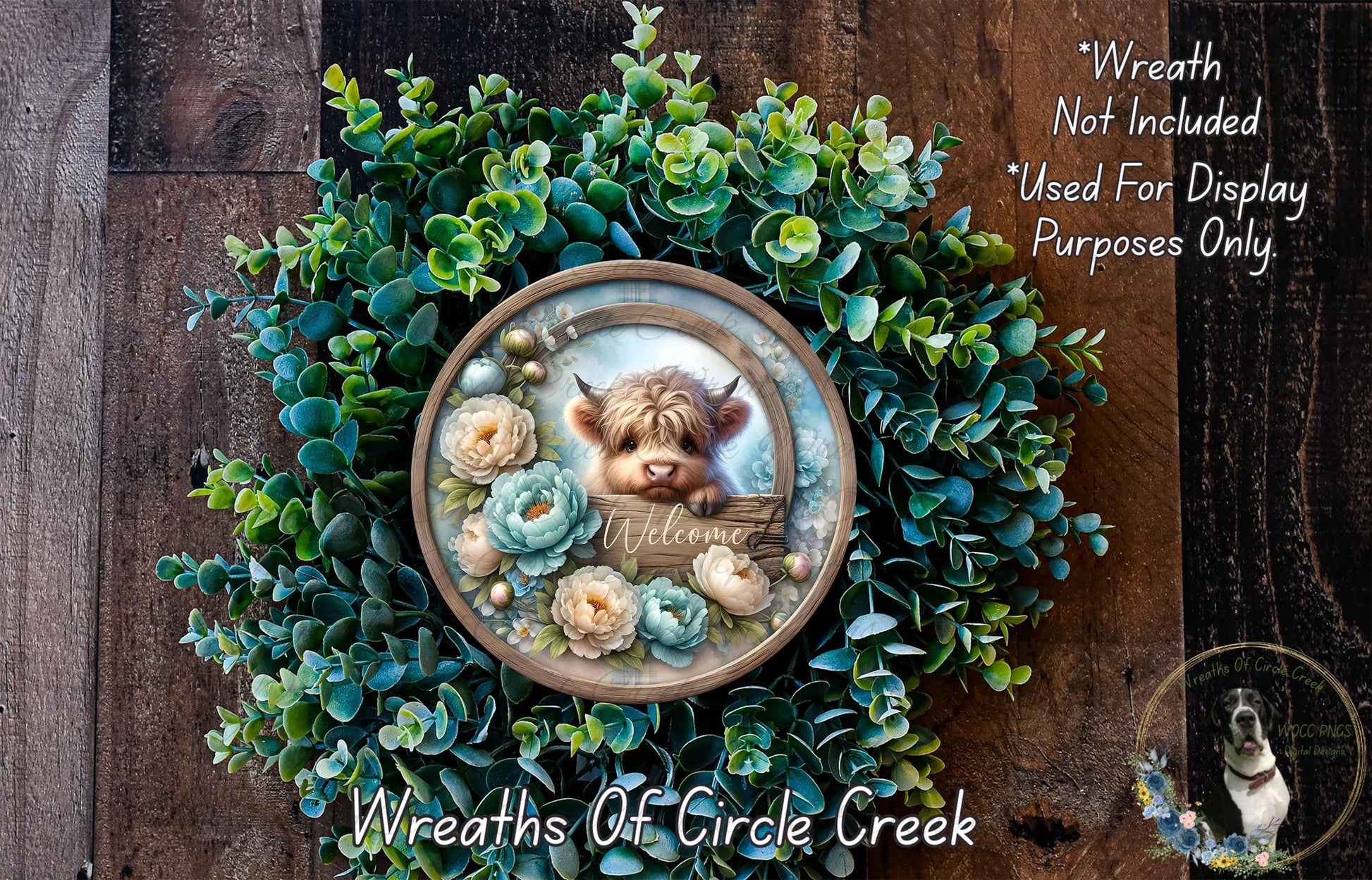 a wreath with a small cow's head and a wooden sign that says "Welcome" in the center. The wreath is surrounded by various green plants and flowers, creating a festive and welcoming atmosphere.