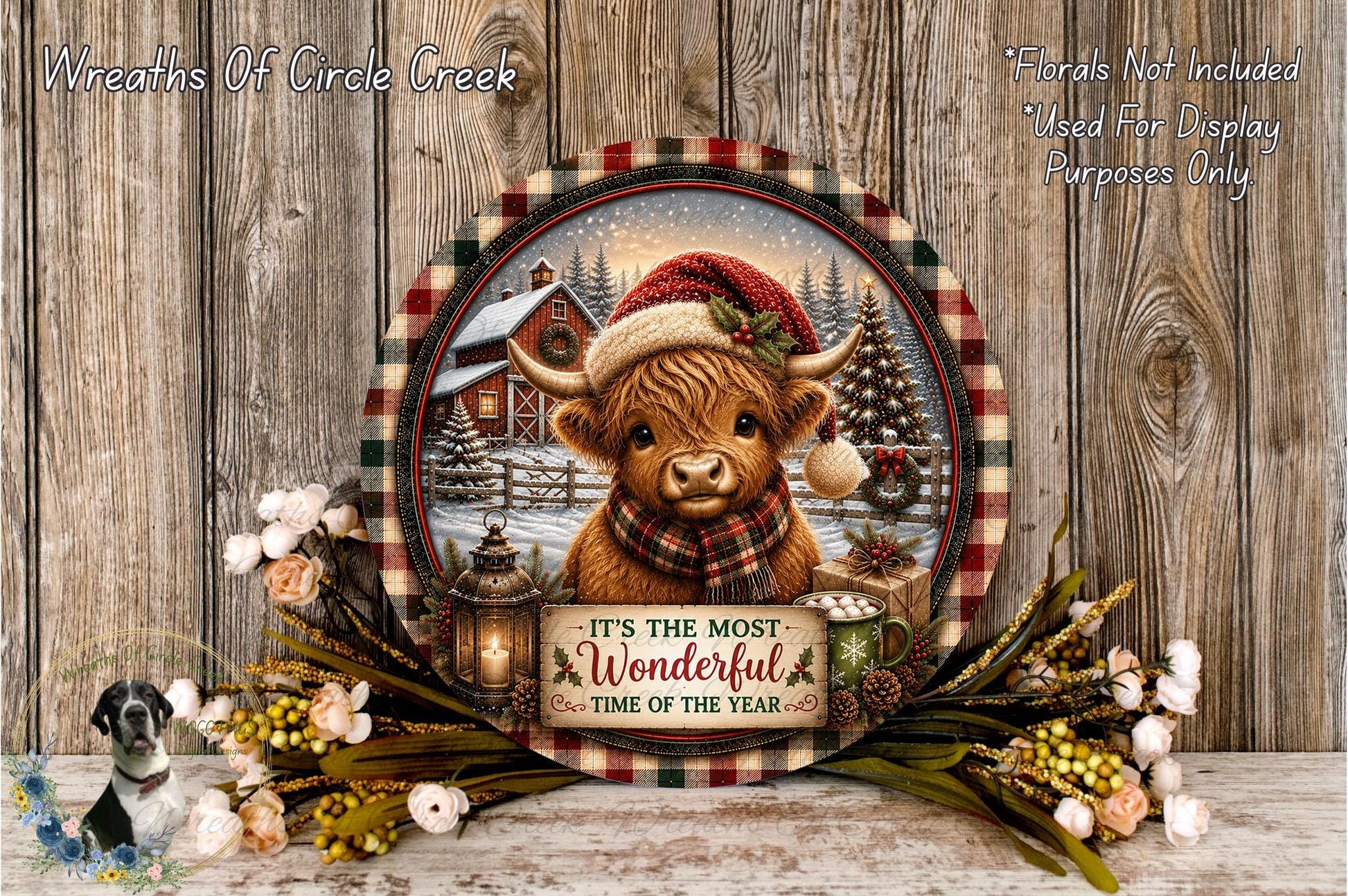 A decorative plate featuring a cow wearing a Santa hat, surrounded by a wreath of flowers and a sign that reads "It's the most Wonderful Time of the Year".