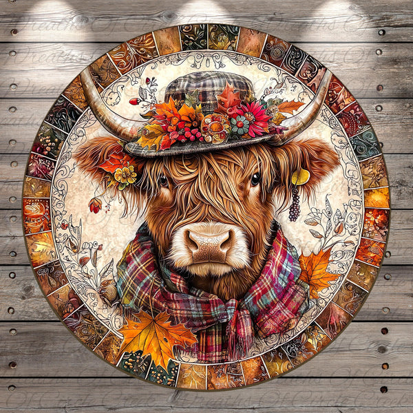 A detailed illustration of a cow wearing a hat with flowers and leaves, surrounded by autumn leaves and a plaid scarf.