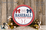 a round sign with the text "Baseball is my favorite season" and a baseball graphic, surrounded by a red and white polka dot border and a wreath of flowers.