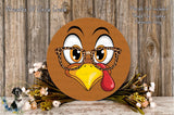 A round wooden sign with a cartoon turkey face wearing glasses and a red beak, surrounded by flowers and a wooden background.