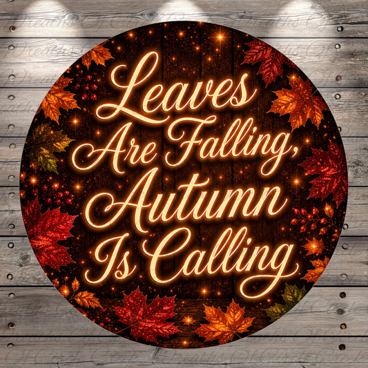 a circular design with a wooden background and autumn leaves. The text on the design reads "Leaves Are Falling, Autumn Is Calling".