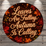 a circular design with a wooden background and autumn leaves. The text on the design reads "Leaves Are Falling, Autumn Is Calling".