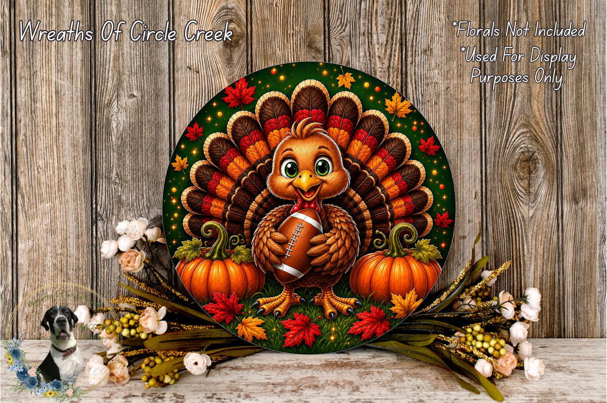 A decorative Thanksgiving wreath featuring a turkey holding a football, surrounded by pumpkins and autumn leaves, with a wooden background.