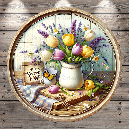 A round wooden frame containing a vibrant bouquet of yellow, pink, and white tulips, along with a white pitcher, a wooden cutting board, and a butterfly. The background features a wooden wall with a "Home Sweet Home" sign.
