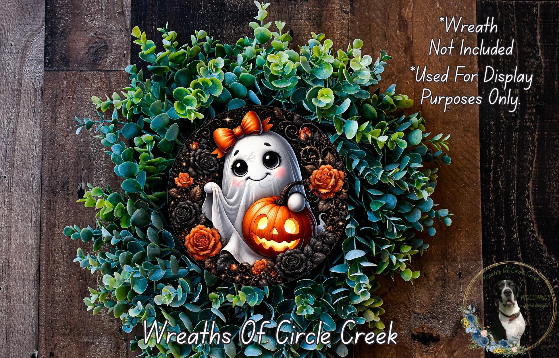A Halloween-themed wreath made of green succulents and featuring a ghost holding a carved pumpkin.