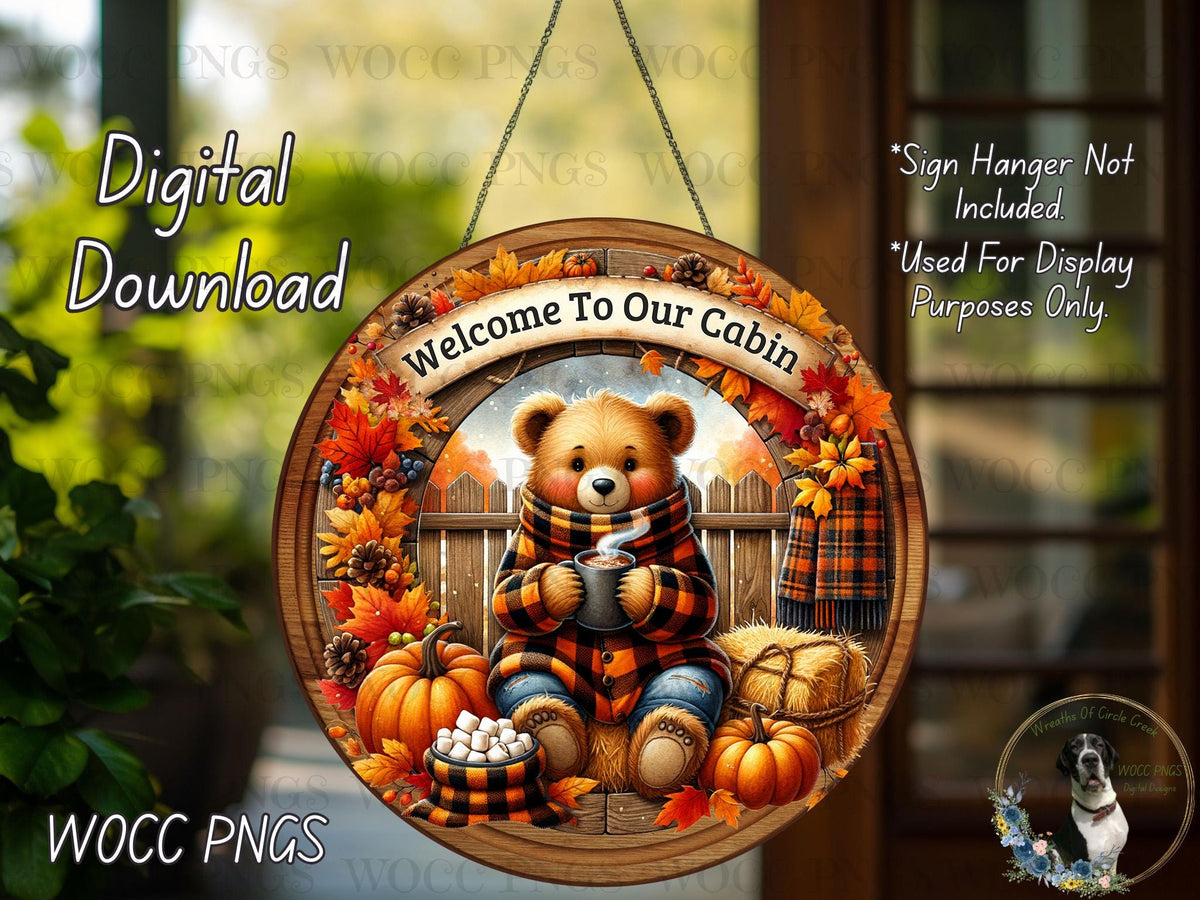 The image is a digital download of a welcome sign for a cabin, featuring a teddy bear wearing a scarf and holding a mug, surrounded by autumn decorations such as pumpkins, leaves, and a dog.