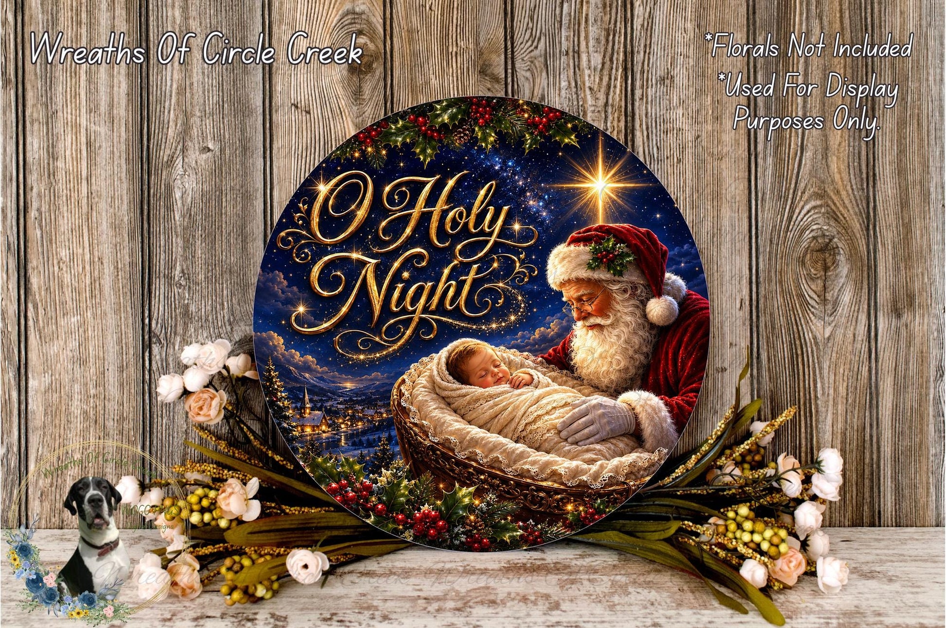 A round decorative plate with a painting of Santa Claus holding a baby in his arms, surrounded by a wreath of flowers and a star.