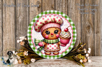 A round wooden plaque featuring a gingerbread man wearing a chef's hat and holding a cupcake, surrounded by a floral arrangement and a wooden background.