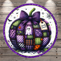 A patchwork pumpkin with a purple bow, surrounded by various Halloween-themed elements such as bats, a spider web, and a ghost.